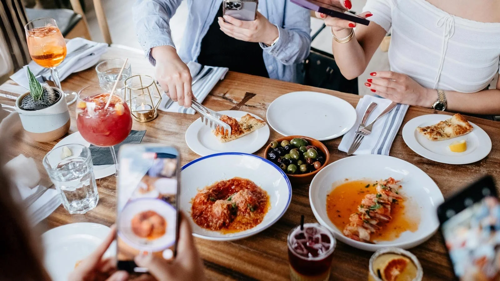 Photographers Taking Photos of Restaurant Meal