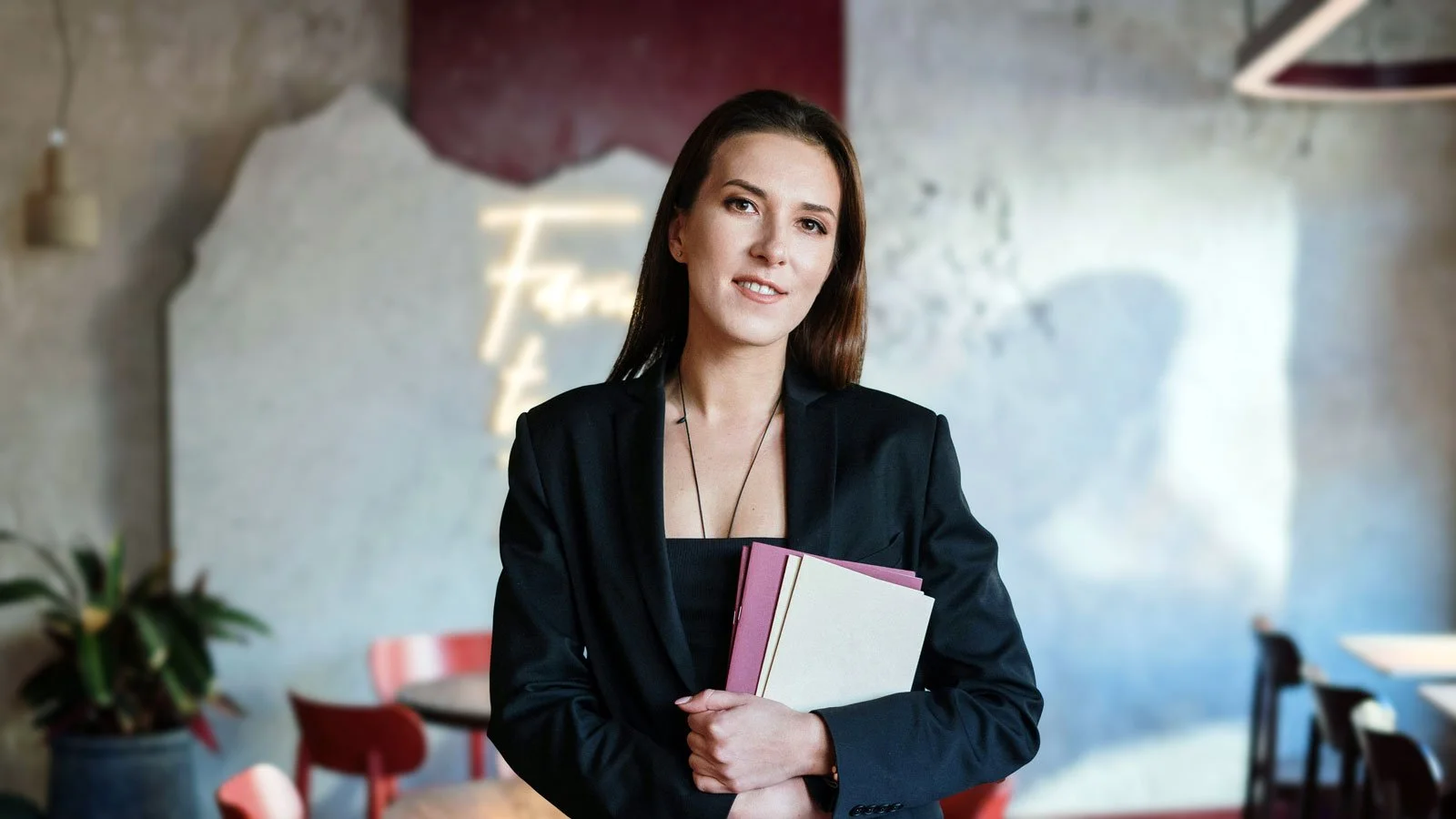 Woman in Black Blazer Holding Menu